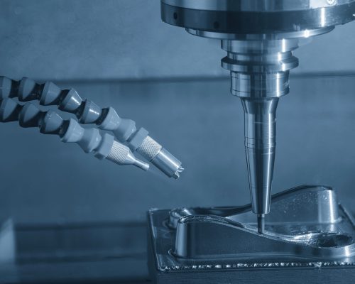 The CNC milling machine cutting  mold part by solid ball nose end mill tool in the light blue scene. The mold parts cutting process by machining center with solid ball end mill.